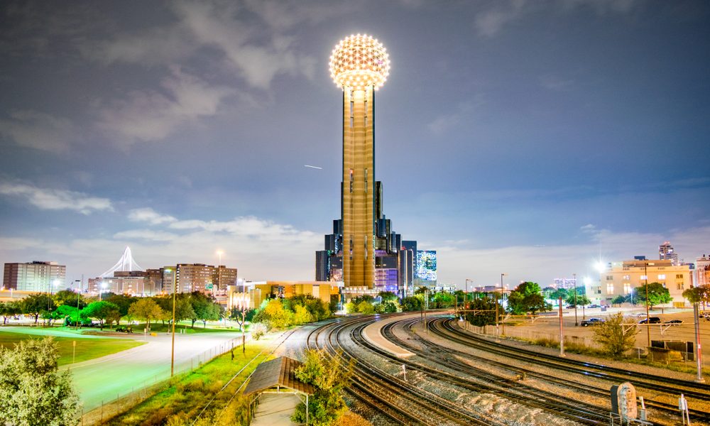 Iconic,Observation,Tower,,Railroad,Tracks,And,City,Park,At,Night